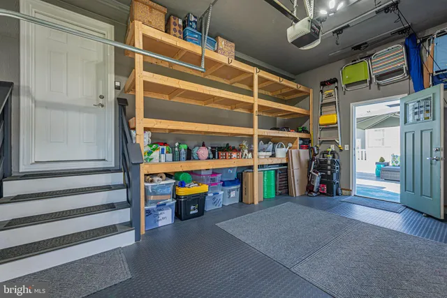 a view of water heater room with shelves
