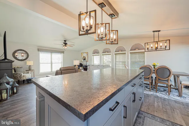 an aerial view of kitchen and dining room