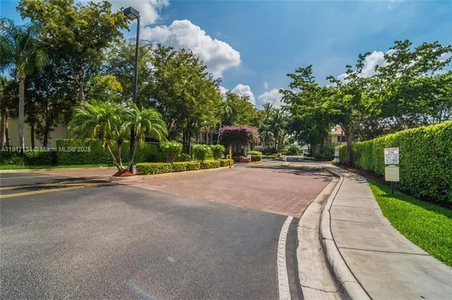 a living room with furniture potted plant and a window