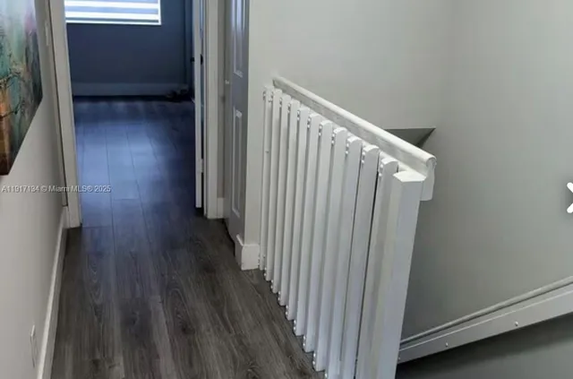 a kitchen with stainless steel appliances granite countertop a stove microwave and refrigerator