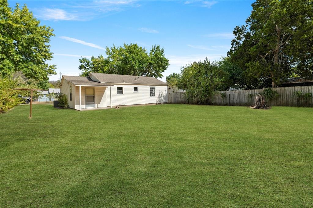 2411 Denison Street Denton, TX 76201 - Photo 14 of 15 a view of a house with a yard