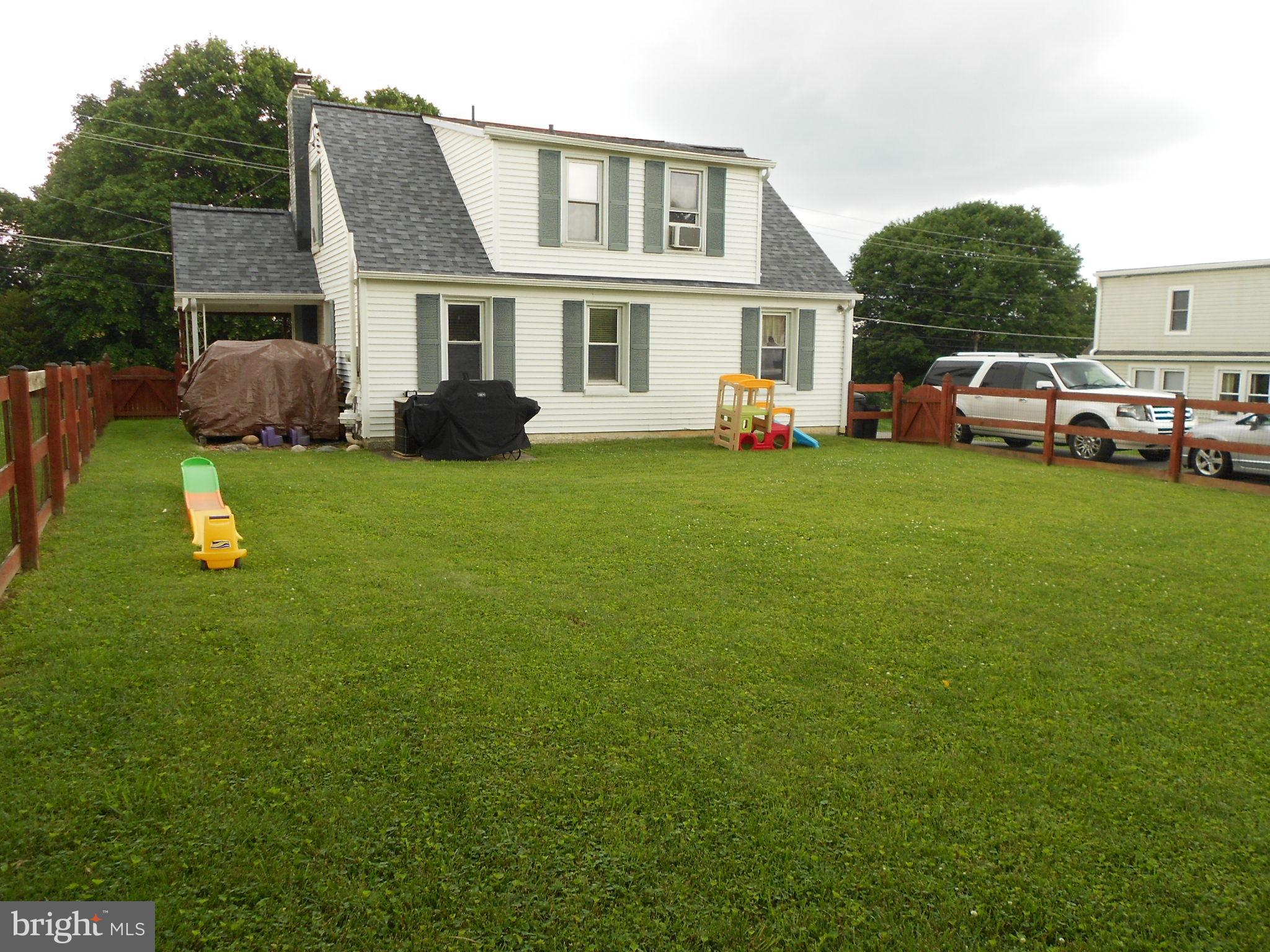 15304 Old Hanover Road Upperco, MD 21155 - Photo 32 of 36 Yard leads to side patio (behind wood pile)