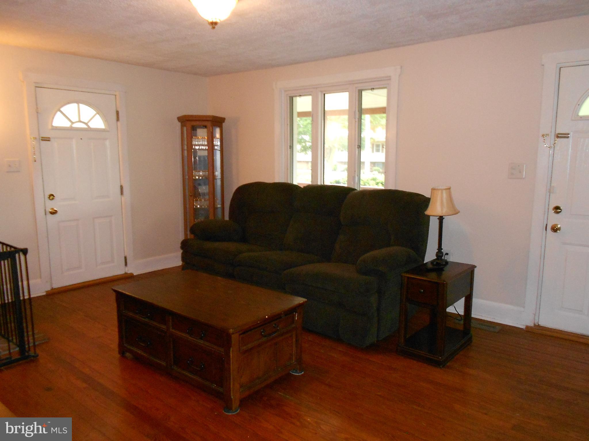 15304 Old Hanover Road Upperco, MD 21155 - Photo 5 of 36 Living room with picture window & access to patio