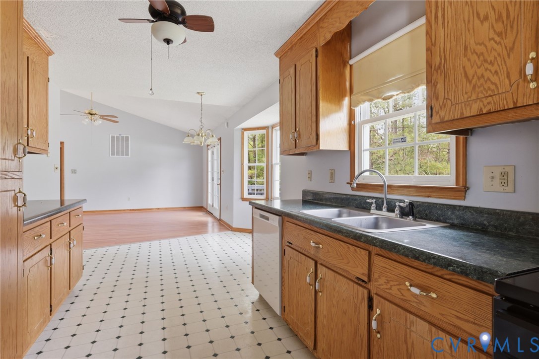 7208 Brandon Lane Prince George, VA 23875 - Photo 12 of 26 a kitchen with a sink a stove a refrigerator and cabinets
