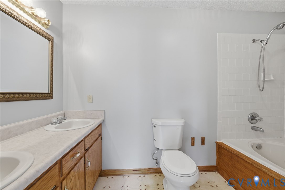 7208 Brandon Lane Prince George, VA 23875 - Photo 17 of 26 a bathroom with a sink a toilet and shower