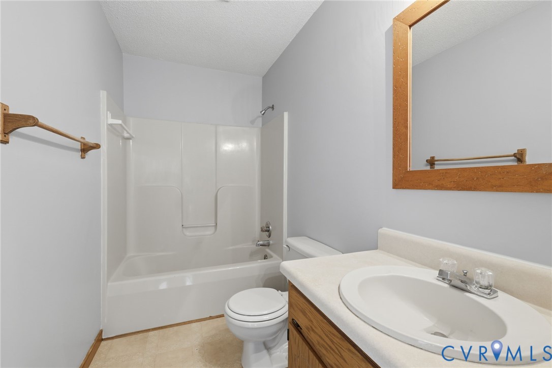 7208 Brandon Lane Prince George, VA 23875 - Photo 20 of 26 a bathroom with a sink toilet and shower