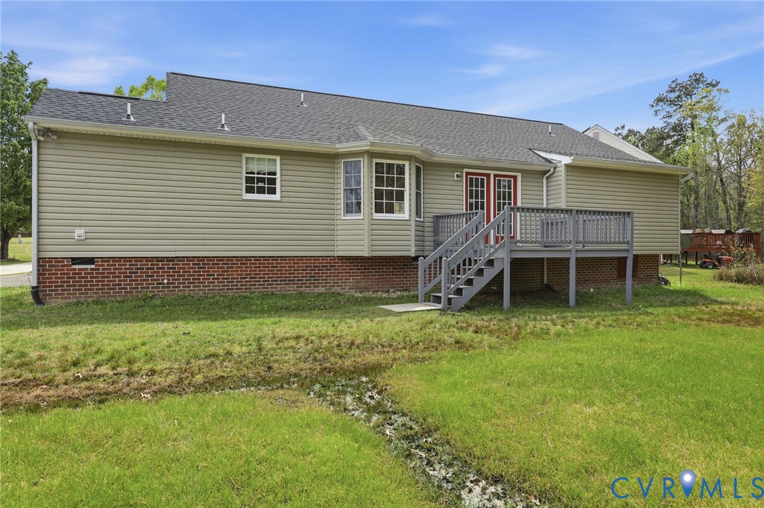 7208 Brandon Lane Prince George, VA 23875 - Photo 2 of 26 a backyard of a house with wooden deck and green space