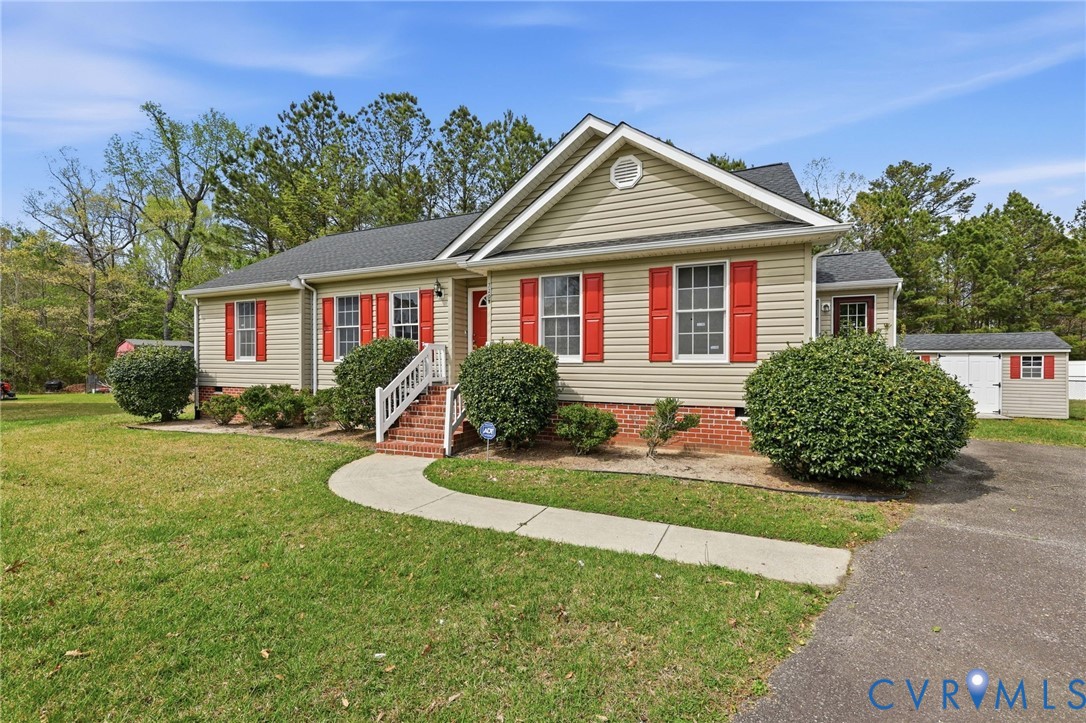 7208 Brandon Lane Prince George, VA 23875 - Photo 25 of 26 a front view of a house with a yard