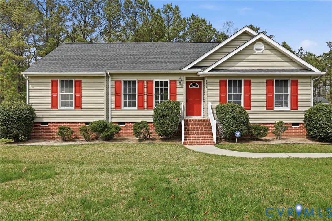 7208 Brandon Lane Prince George, VA 23875 - Photo 4 of 26 a front view of a house with a yard