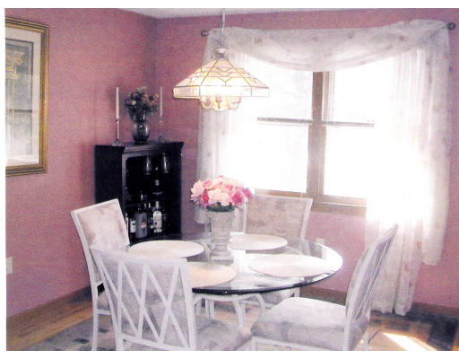 26 Gove Road Billerica, MA 01821 - Photo 2 of 8 a view of a dining room with furniture and window