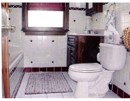 26 Gove Road Billerica, MA 01821 - Photo 3 of 8 a bathroom with a sink a toilet and a mirror