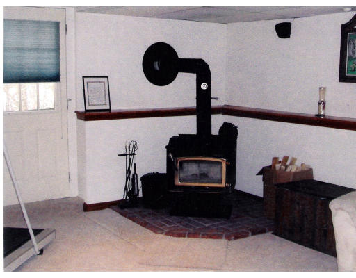 26 Gove Road Billerica, MA 01821 - Photo 8 of 8 a living room with furniture and a fireplace