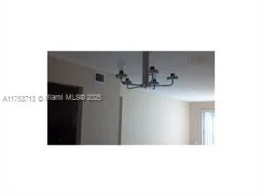 a black and white photo of a living room