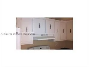 a bathroom with a sink a mirror and a bathtub