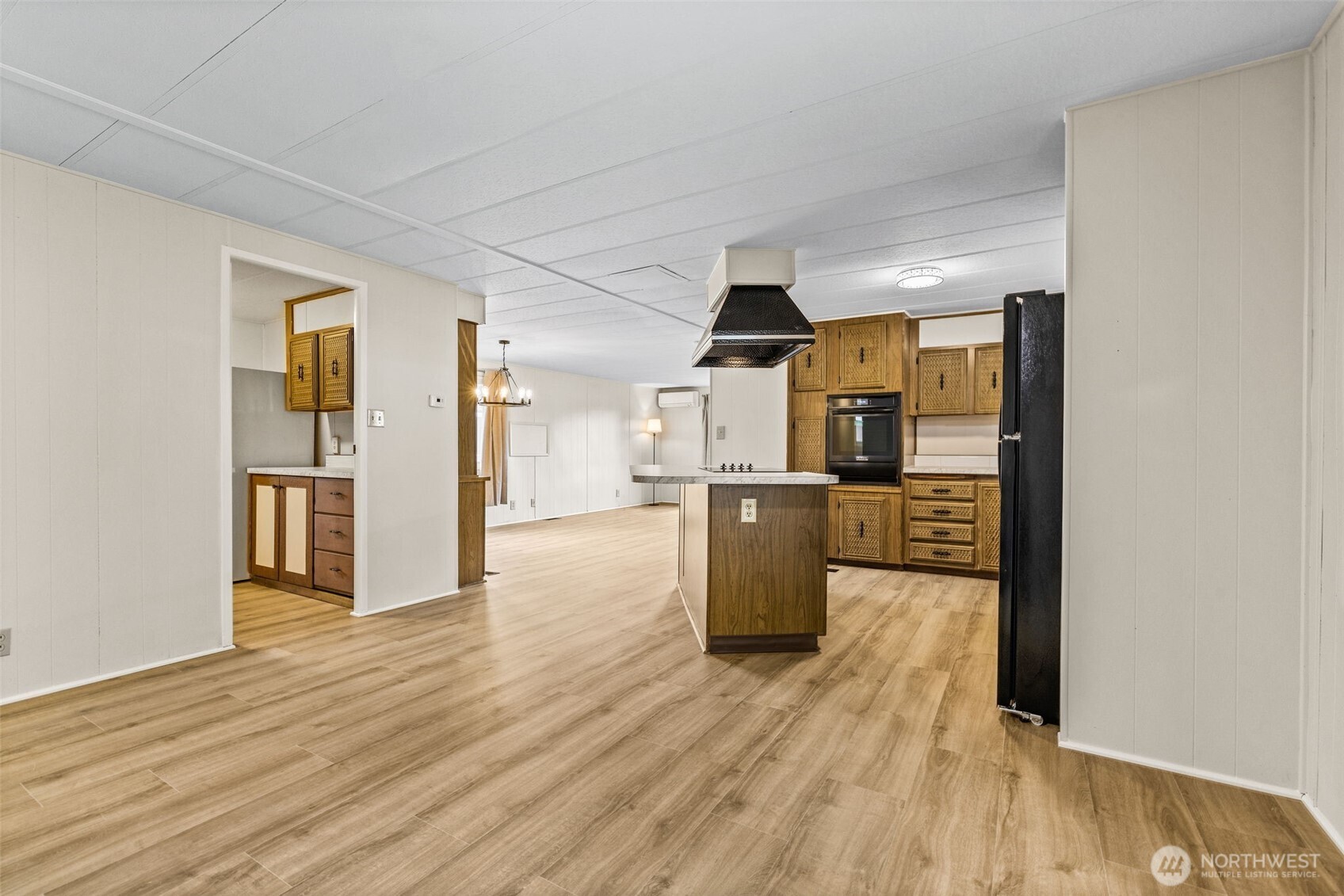 11330 East Riverside Drive, Unit 7 Bothell, WA 98011 - Photo 11 of 32 a view of kitchen and wooden floor