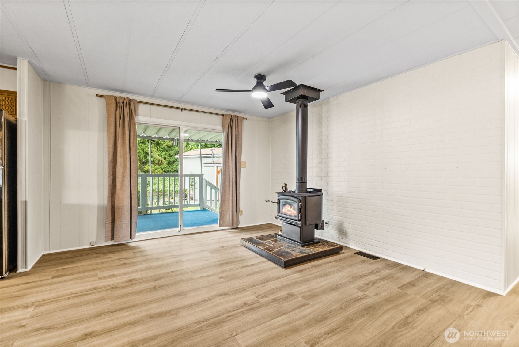 11330 East Riverside Drive, Unit 7 Bothell, WA 98011 - Photo 15 of 32 a view of a livingroom with a lounge chair and a window