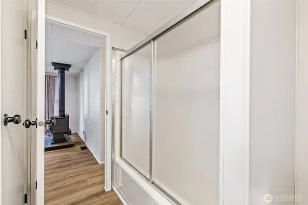 a view of a bathroom from the hallway