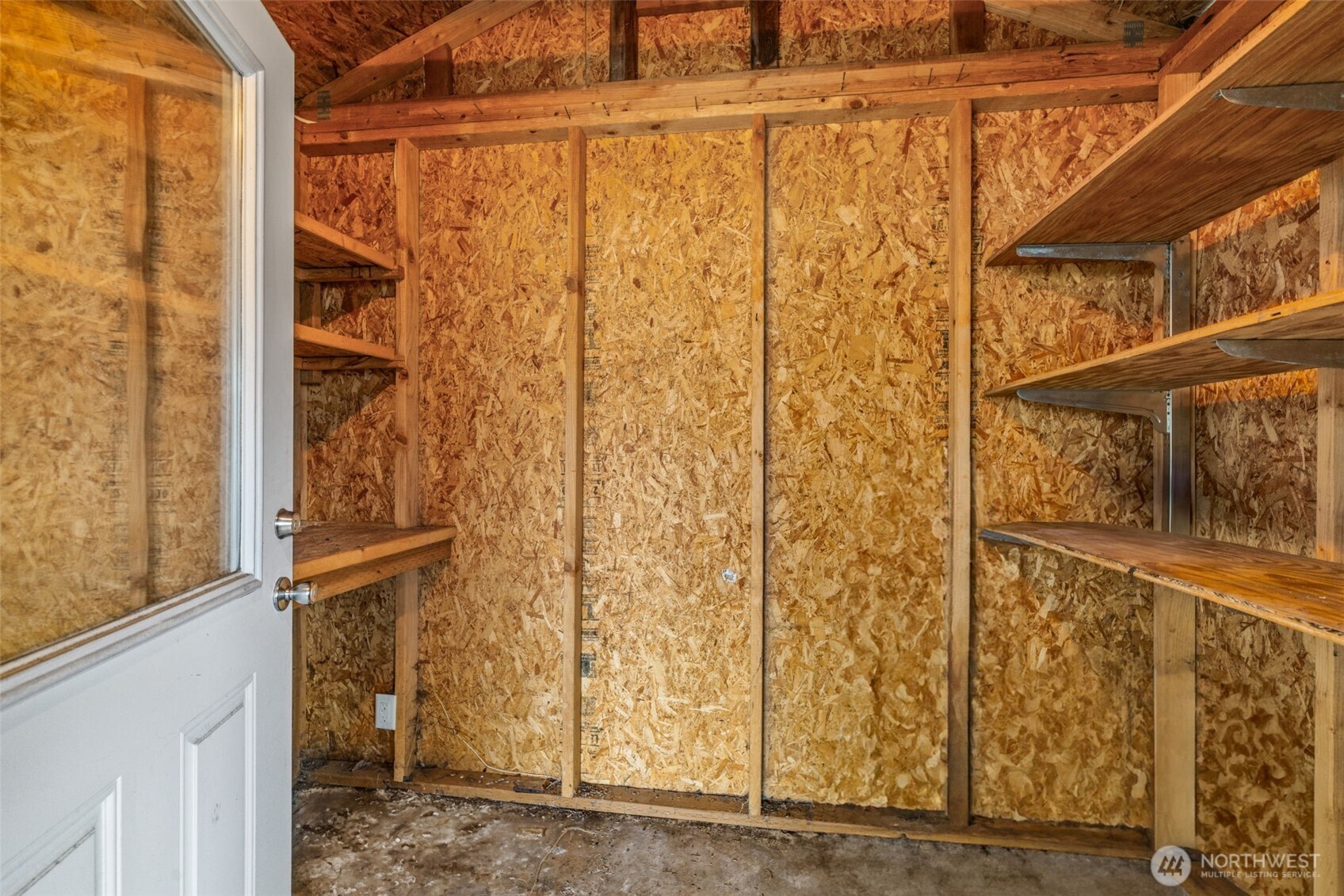 11330 East Riverside Drive, Unit 7 Bothell, WA 98011 - Photo 28 of 32 a view of a small room with wooden walls and door