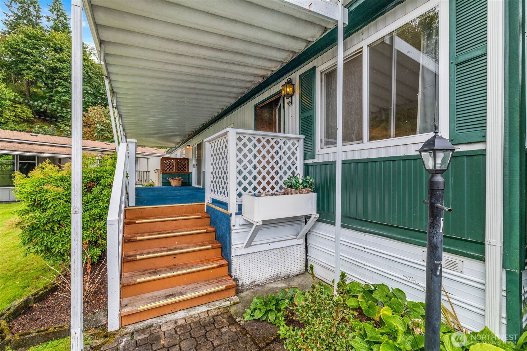 11330 East Riverside Drive, Unit 7 Bothell, WA 98011 - Photo 4 of 32 a balcony view with a garden