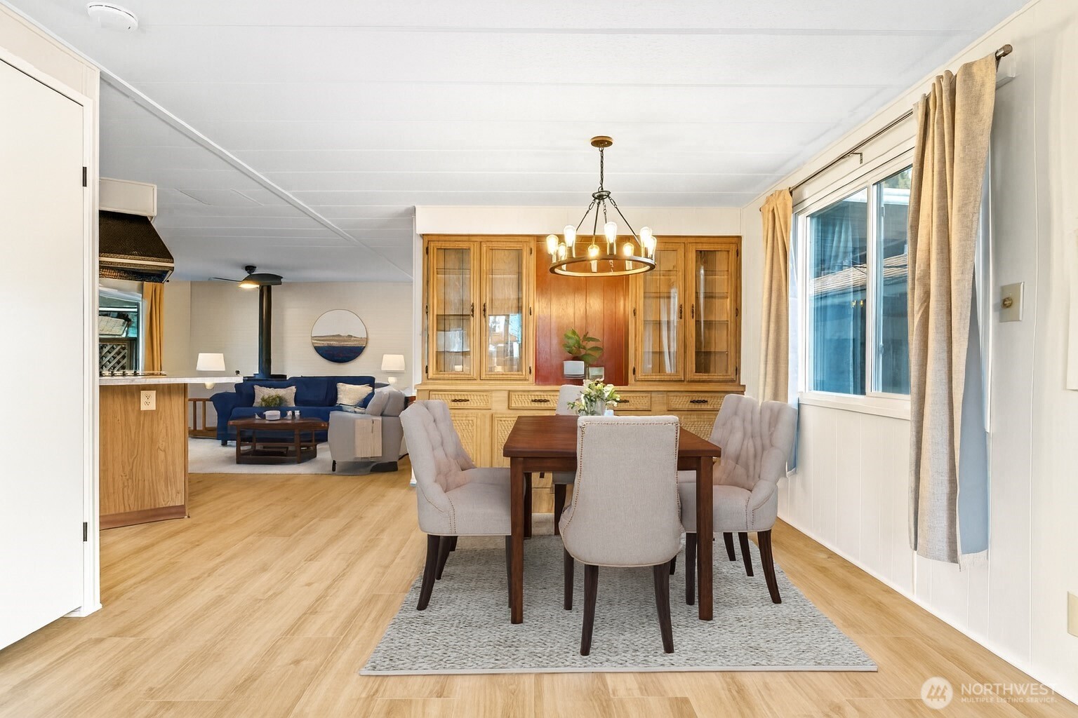 11330 East Riverside Drive, Unit 7 Bothell, WA 98011 - Photo 9 of 32 a view of a dining room with furniture and wooden floor