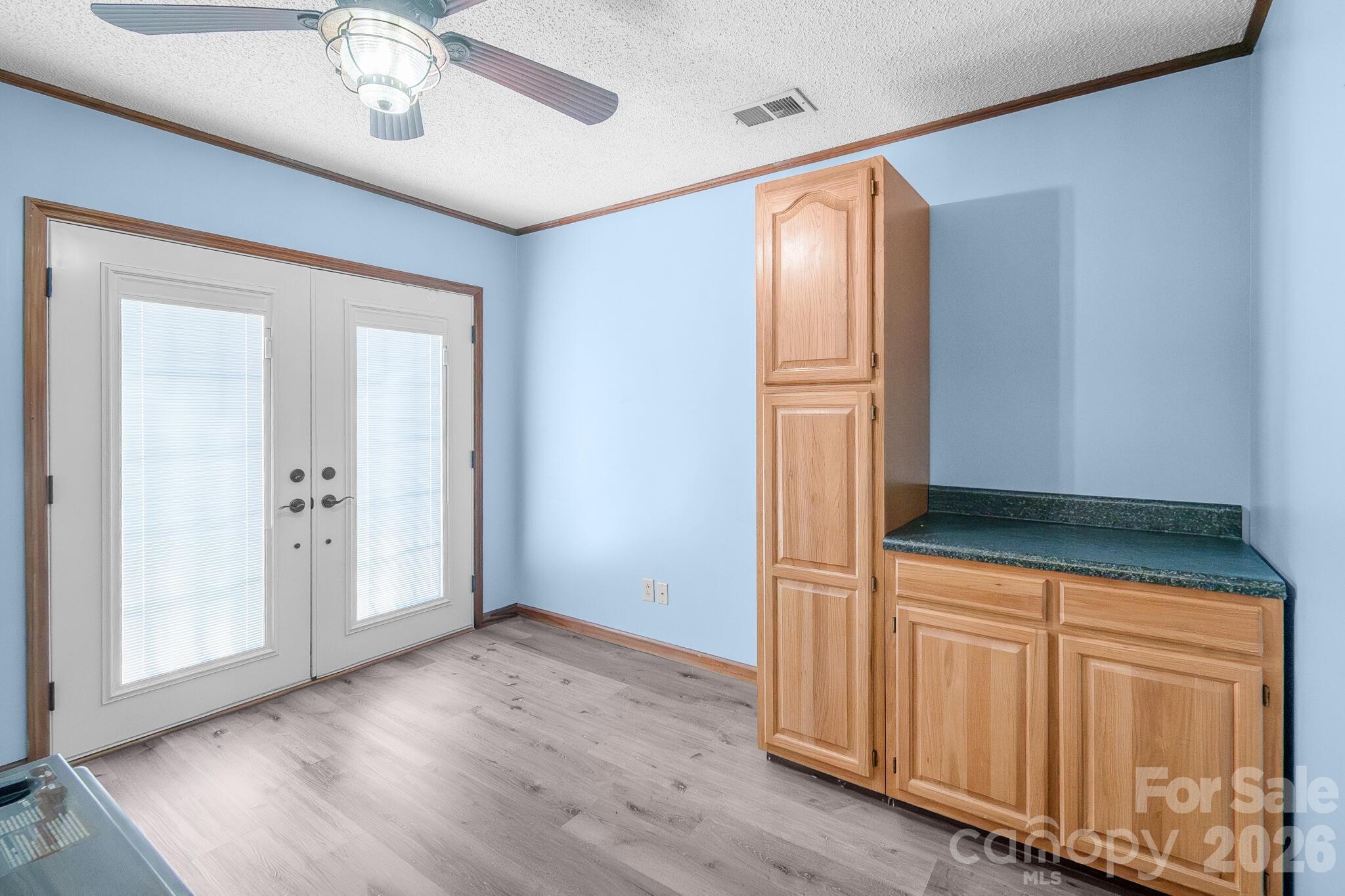 1295 Cattle Ridge Road Cheraw, SC 29520 - Photo 17 of 21 an empty room with wooden floor closet and windows