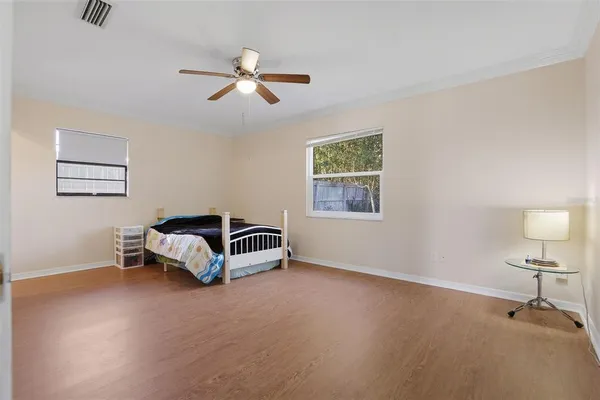 a room with a bed and a chandelier