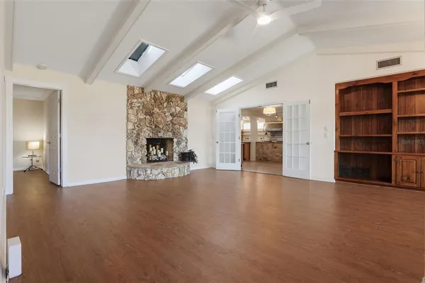 a view of a livingroom with furniture and a fireplace
