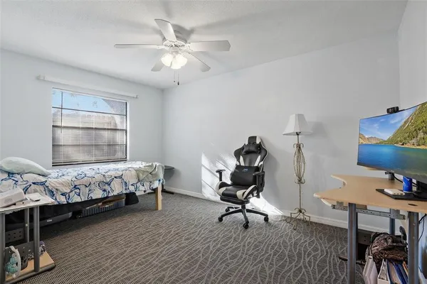 a bedroom with bed and a window