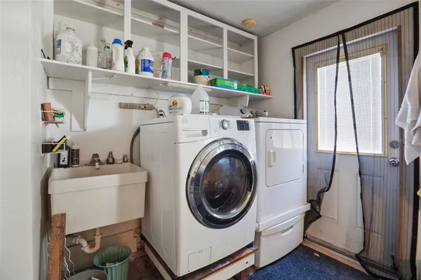 a utility room with dryer and washer