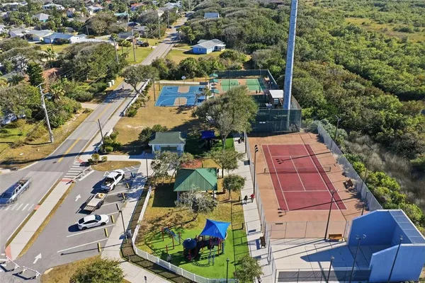 an aerial view of residential houses with outdoor space