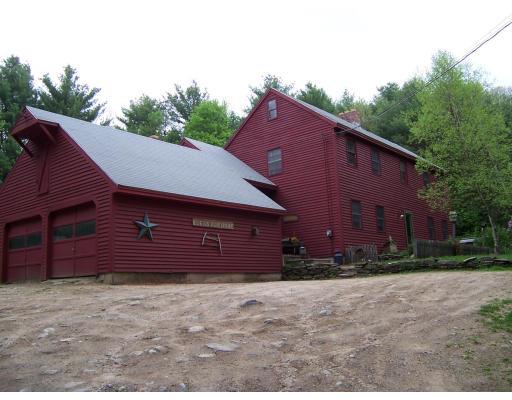 981 Patriots Road Templeton, MA 01468 - Photo 1 of 3 a front view of a house with a yard