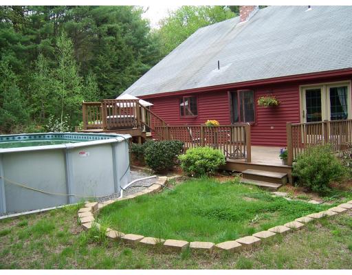 981 Patriots Road Templeton, MA 01468 - Photo 3 of 3 a front view of a house with a yard
