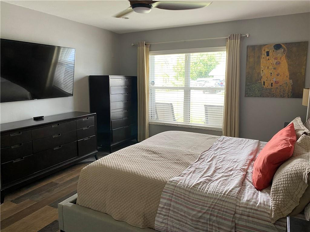 1978 Park Place Boca Raton, FL 33486 - Photo 13 of 34 a bedroom with a bed and a flat screen tv