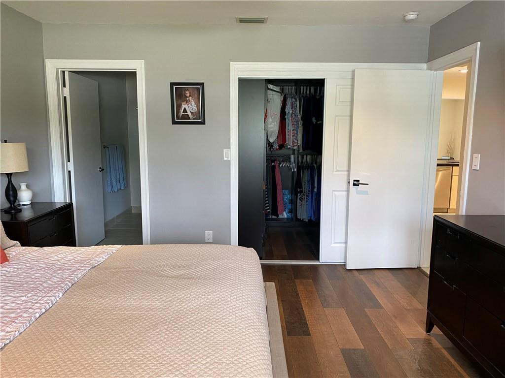 1978 Park Place Boca Raton, FL 33486 - Photo 14 of 34 a bedroom with a bed and a flat screen tv