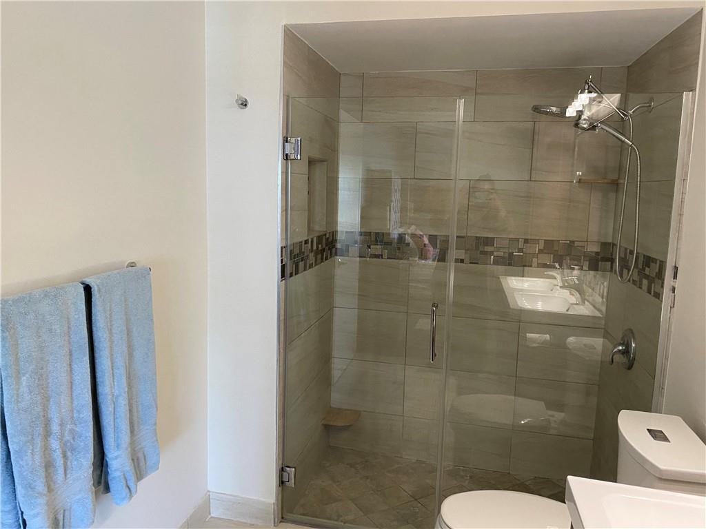 1978 Park Place Boca Raton, FL 33486 - Photo 16 of 34 a bathroom with a shower and toilet