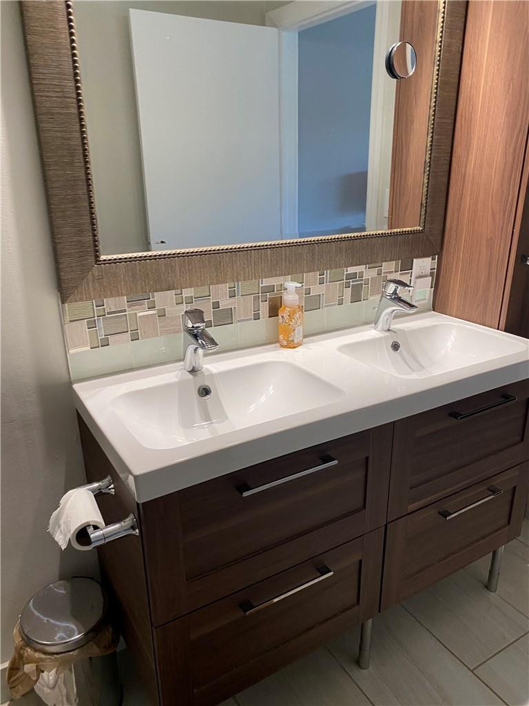 1978 Park Place Boca Raton, FL 33486 - Photo 18 of 34 a bathroom with a sink and a toilet