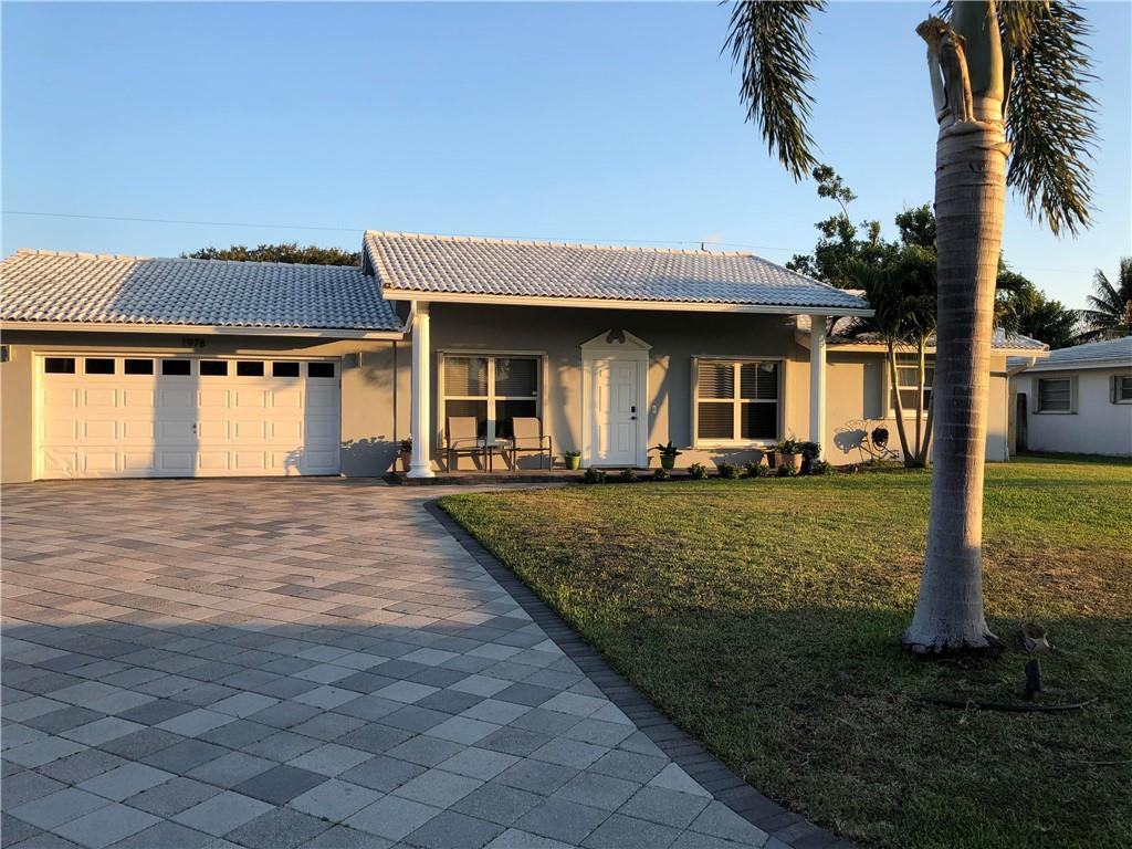 1978 Park Place Boca Raton, FL 33486 - Photo 2 of 34 front view of a house with a yard