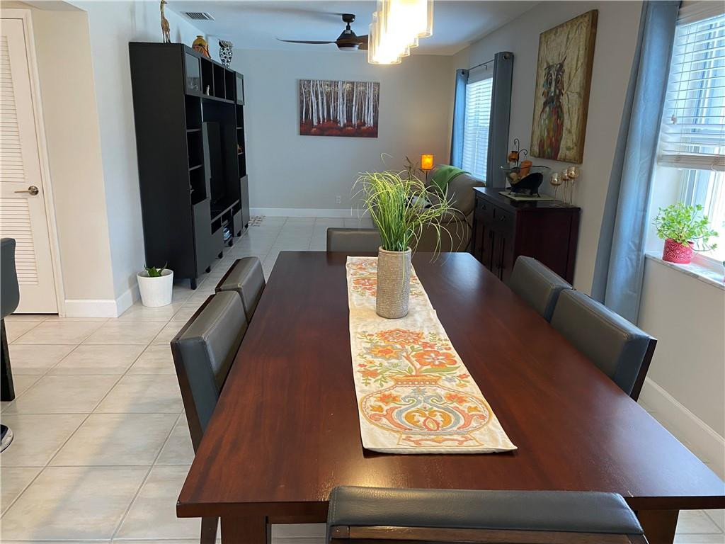1978 Park Place Boca Raton, FL 33486 - Photo 27 of 34 a view of a hallway with furniture and a potted plant