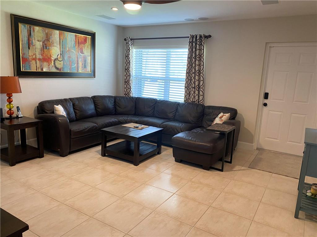 1978 Park Place Boca Raton, FL 33486 - Photo 3 of 34 a living room with furniture and window