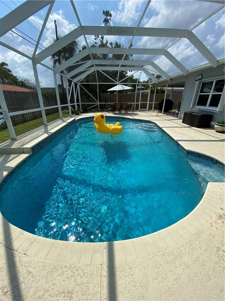 1978 Park Place Boca Raton, FL 33486 - Photo 32 of 34 a view of a swimming pool with a patio