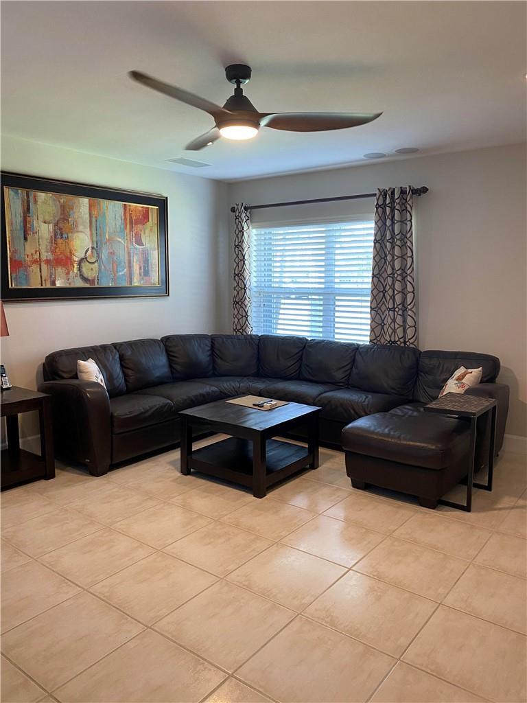 1978 Park Place Boca Raton, FL 33486 - Photo 4 of 34 a living room with furniture and a window