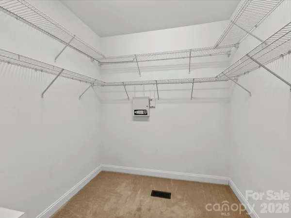 a work room with furniture and a window