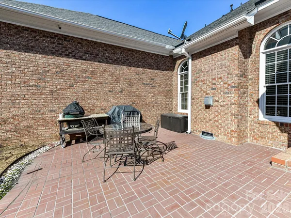 a view of a backyard with a large tree
