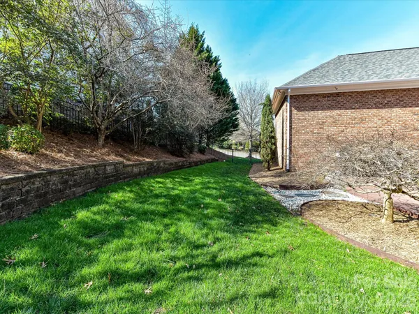 a view of backyard with swimming pool and porch