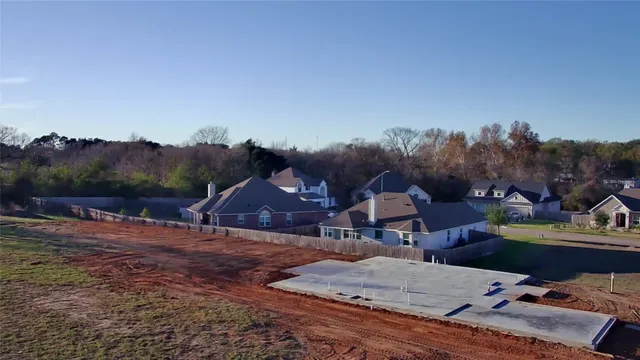 a front view of a house with swimming pool and porch