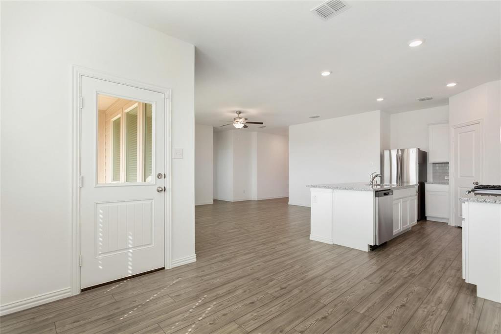 2157 Clarion Drive Forney, TX 75126 - Photo 19 of 28 a view of kitchen with furniture and refrigerator