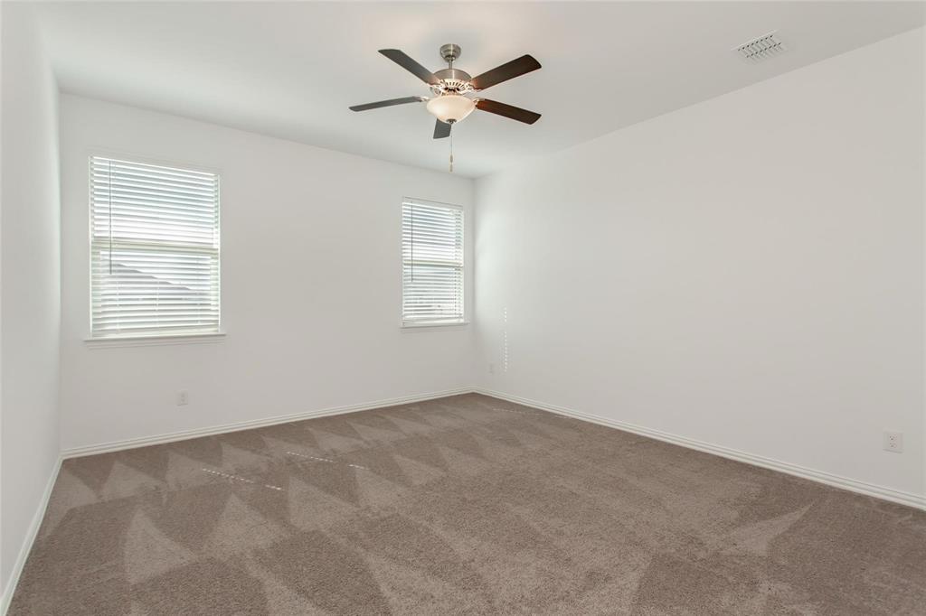 2157 Clarion Drive Forney, TX 75126 - Photo 21 of 28 an empty room with a window and a ceiling fan