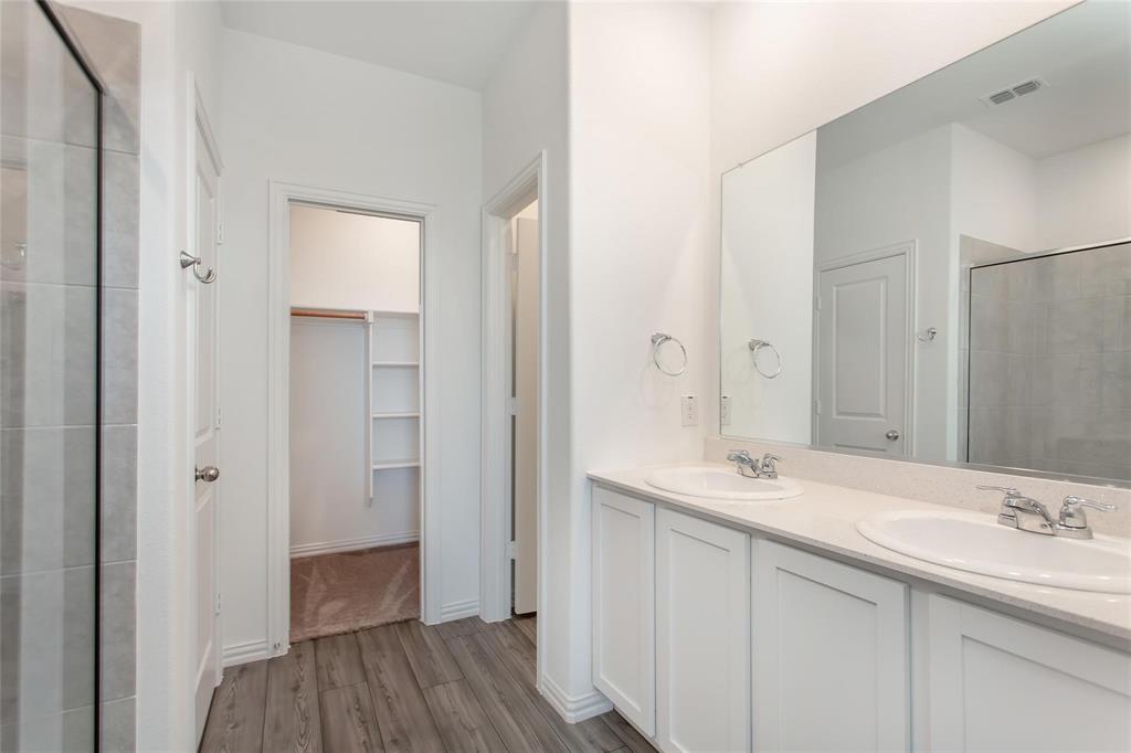 2157 Clarion Drive Forney, TX 75126 - Photo 24 of 28 a bathroom with a sink and a mirror