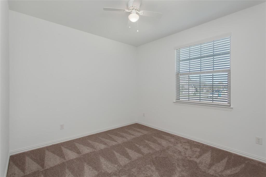 2157 Clarion Drive Forney, TX 75126 - Photo 5 of 28 an empty room with a window