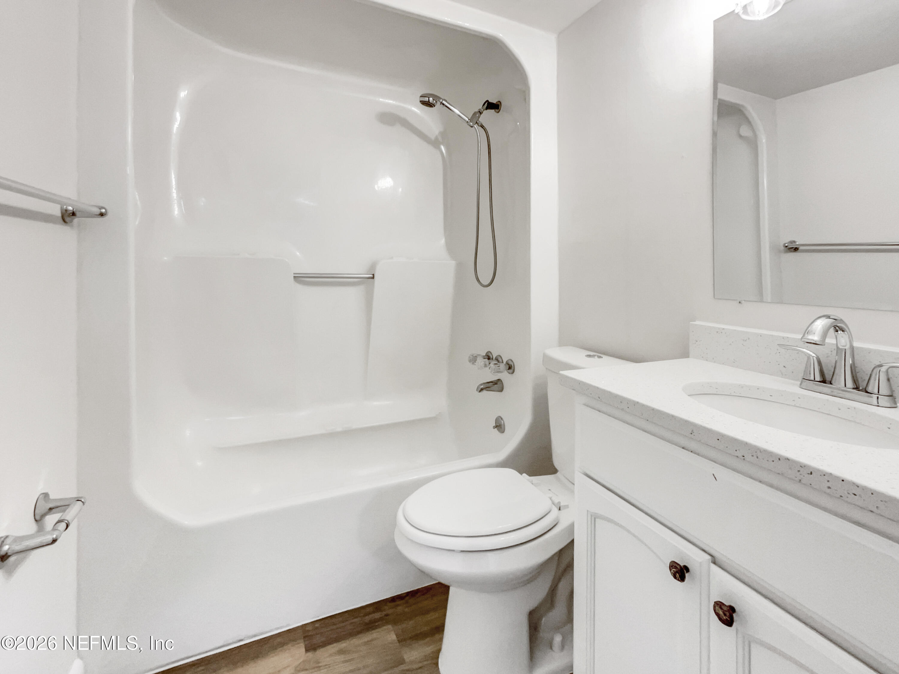 7208 Cypress Cove Road, Unit 13 Jacksonville, FL 32244 - Photo 17 of 22 a bathroom with a sink a toilet and shower